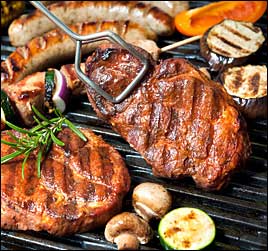 image of steaks, chicken, sausages and vegetables being cooked on a gas charbroiler